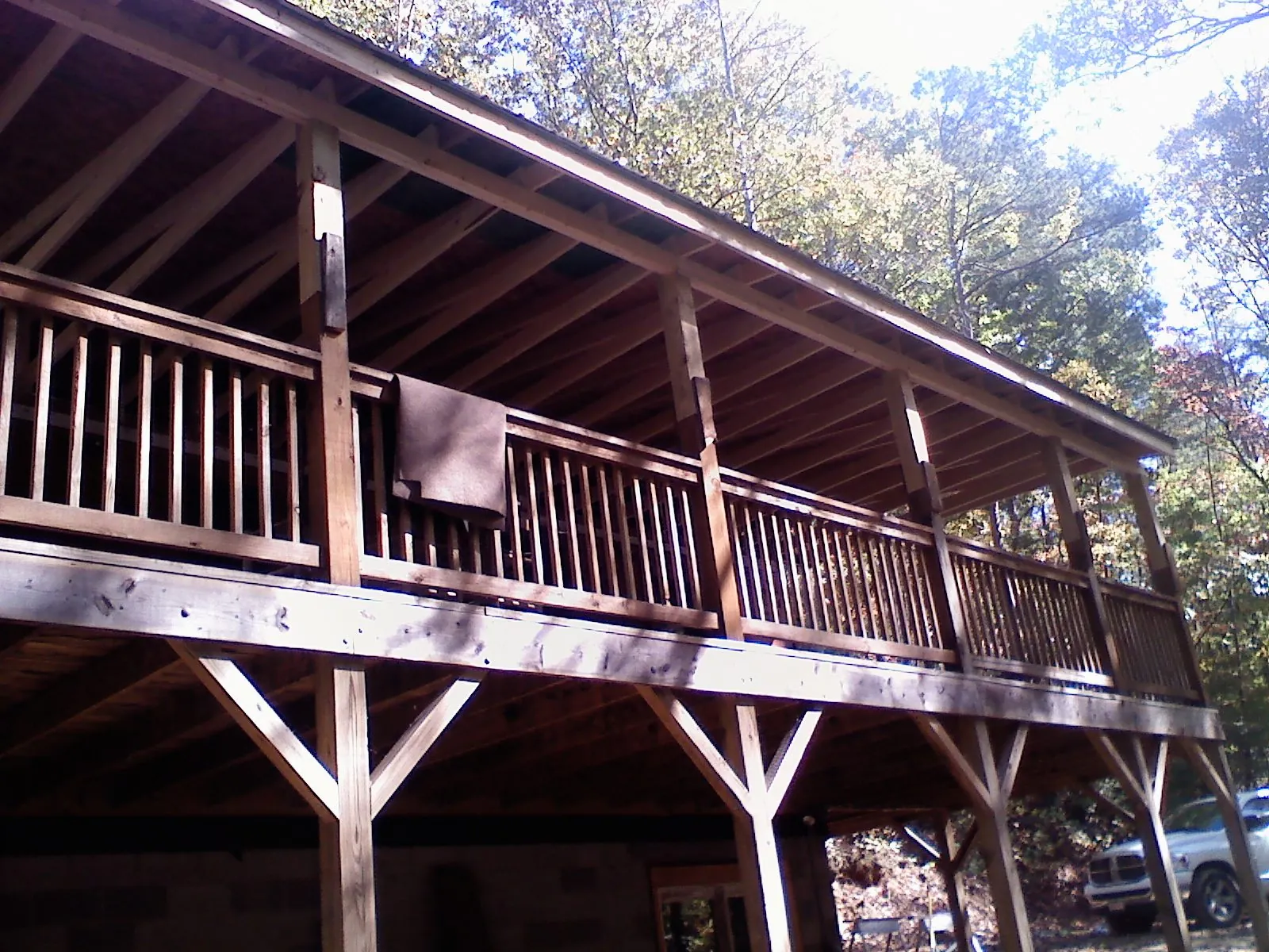 Timber framing under a new elevated porch and deck — Roof Leak Repair in Aleppo by Roofing Brothers